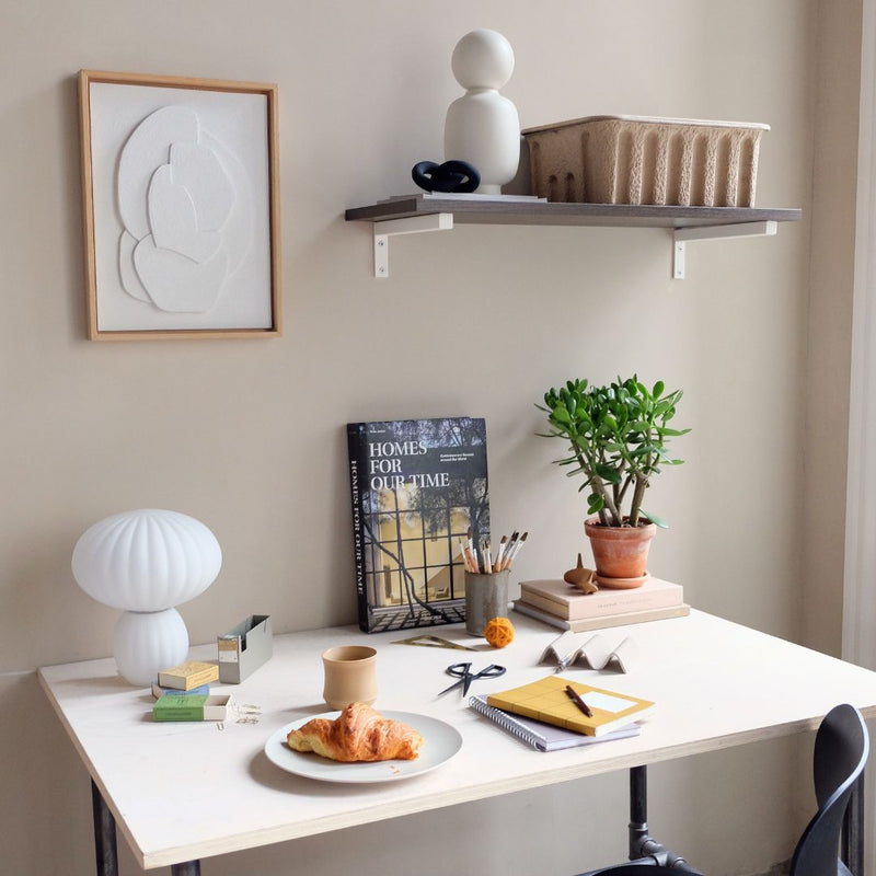 Modern design set up with floating wall mounted shelf in smoked oak with white L brackets